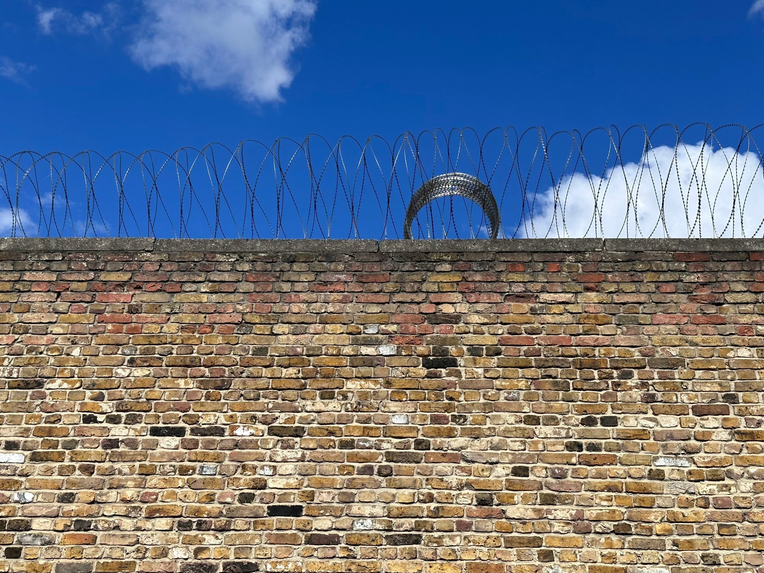 The wall of a prison seen from the outside.